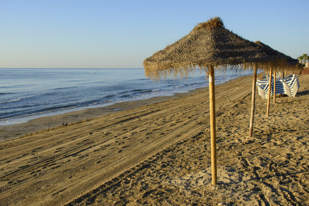 Umbrellas on the beach in Spainの写真素材