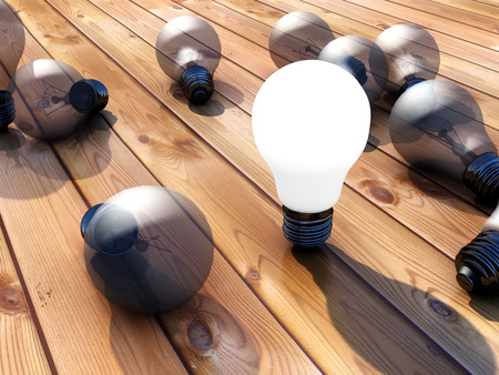 Illuminated lightbulb and parquetの写真素材