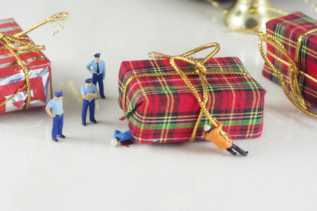 Mini police and accident with Christmas giftの写真素材