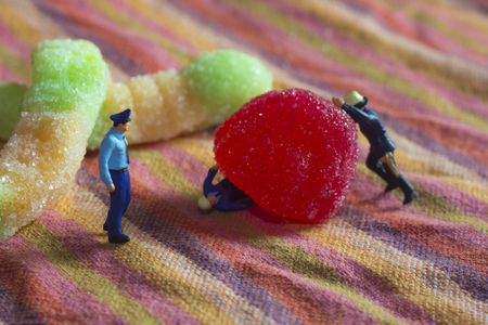 Mini police and crime scene with goodiesの写真素材