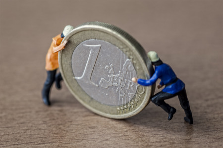 Mini workers and moneyの写真素材