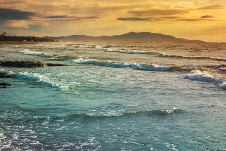 Sunrise on the beach and cloudsの写真素材