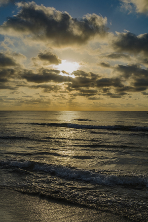 Sunrise on the beach and cloudsの写真素材
