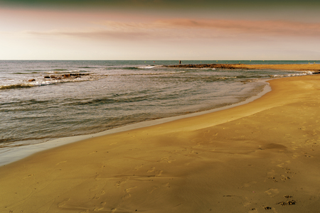 Sunrise on the beach and cloudsの写真素材