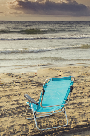 Chair in the sand of the beachの写真素材