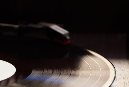 Vinyl record on a black background. Close-up. Selective focus.の写真素材