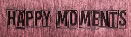 Mahogany wooden board with the inscription happy moments.の写真素材
