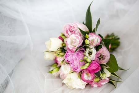 Beautiful wedding bouquet made of white and pink peonies.の写真素材
