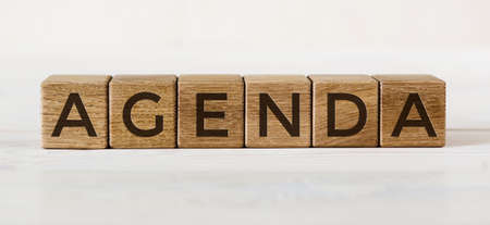 Agenda words from wooden blocks on whiteの写真素材