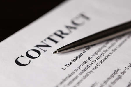 Close-up of word contract with silver pen. Selective focus.の写真素材