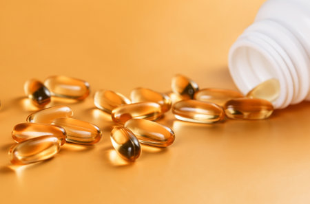 Many capsules out from the bottle on yellowの写真素材