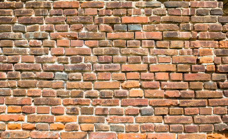 Background of red brick wall texture. Ruined castle.