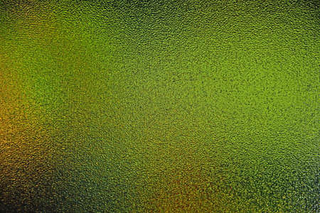 Abstract defocused background of colors in translucent glassの写真素材