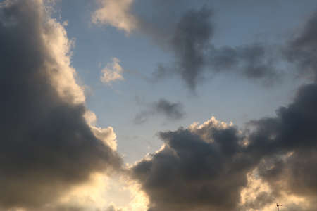 natural background with blue sky and white clouds at sunsetの写真素材