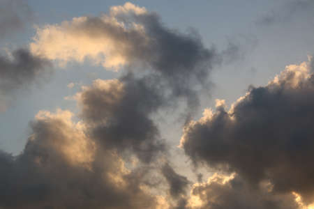 nature background with blue sky and white clouds at sunsetの写真素材