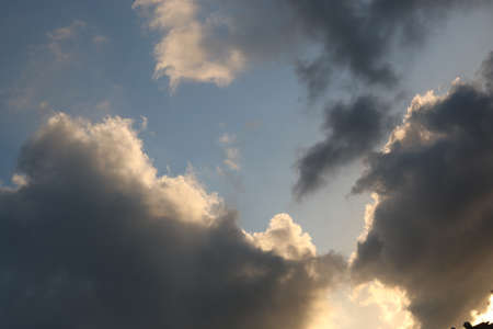 nature background with blue sky and white clouds at sunsetの写真素材
