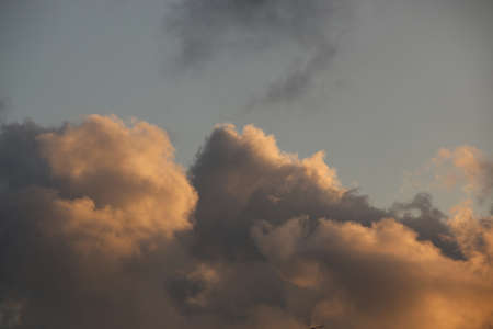 natural background with blue sky and white clouds at sunsetの写真素材