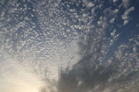 nature background with blue sky and white clouds at sunsetの写真素材