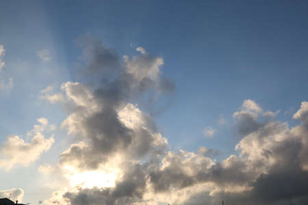 nature background with blue sky and white clouds at sunsetの写真素材