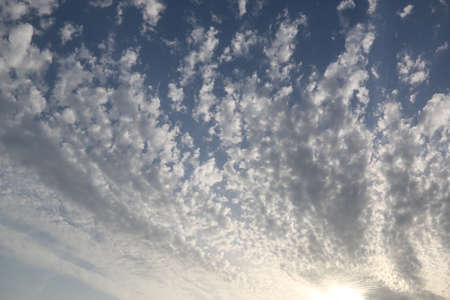 nature background with blue sky and white clouds at sunsetの写真素材