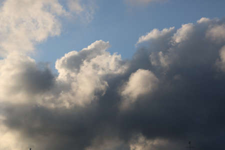 nature background with blue sky and white clouds at sunsetの写真素材