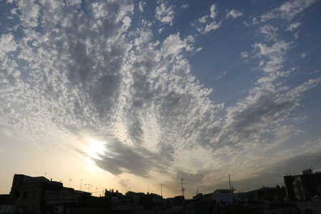 nature background with blue sky and white clouds at sunsetの写真素材