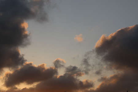natural background with blue sky and white clouds at sunsetの写真素材