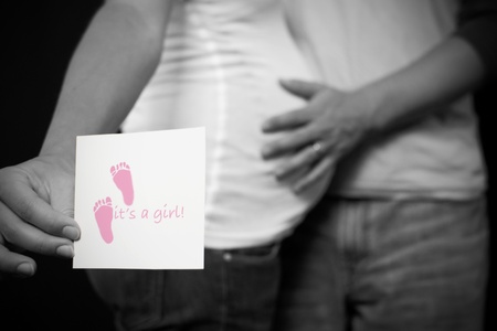 A black and white pregnant couple expecting a baby girl.の写真素材