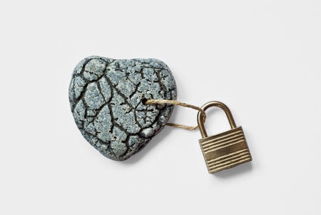 Heart shaped stone with padlockの写真素材