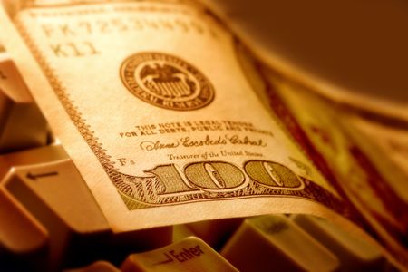 $100 dollar note on a keyboardの写真素材