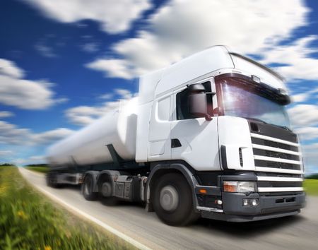 truck driving on country-road/motionの写真素材