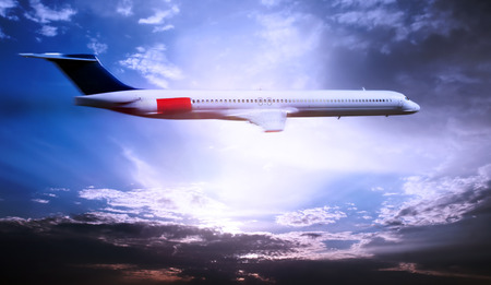 Airplane above the clouds