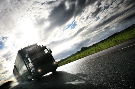 truck driving on country-road/motionの写真素材