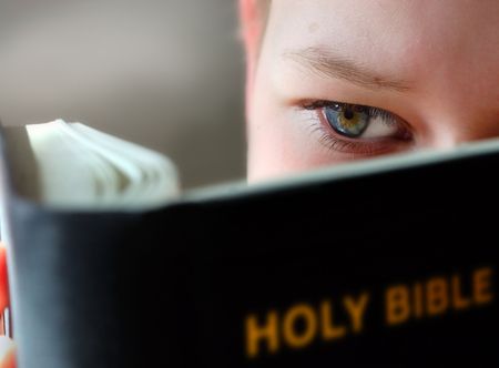 Boy Reading the holy bibleの写真素材