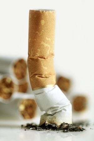 Close up of cigarette on whiteの写真素材