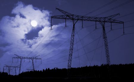 Electricity supply cables in countryside at night