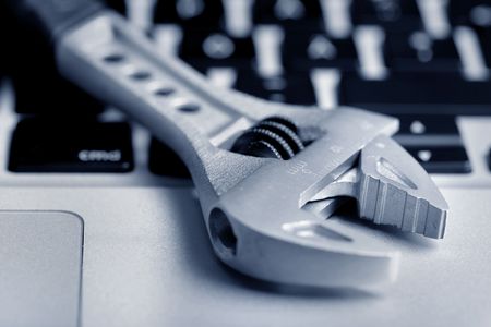 wrench on the laptopの写真素材