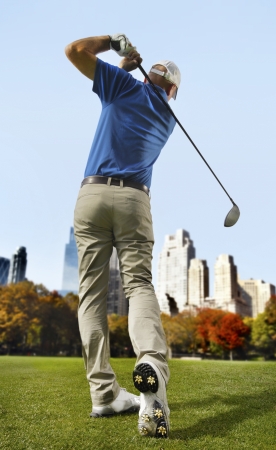 Golfer in the cityの写真素材
