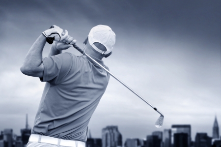 golfer shooting a golf ball の写真素材