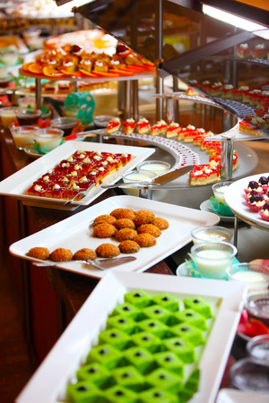 Buffet table full of delicious foodの写真素材