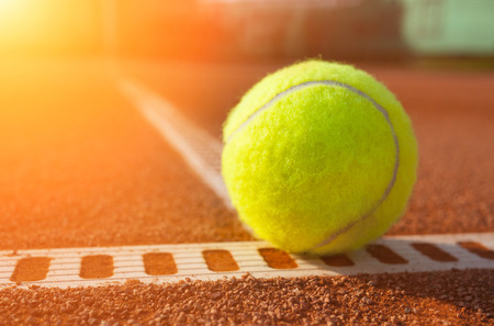 Yellow ball on the court groundの写真素材