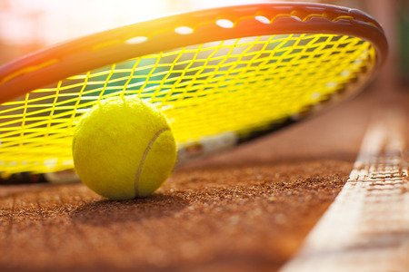 tennis ball on a tennis courtの写真素材