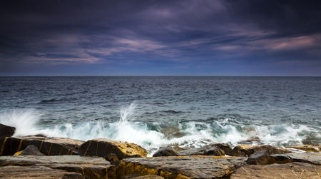 Ligurian sea at sunset in front of the rocksの写真素材