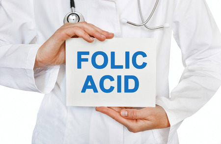 Folic Acid card in hands of Medical Doctorの写真素材