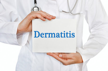 Dermatitis card in hands of Medical Doctorの写真素材
