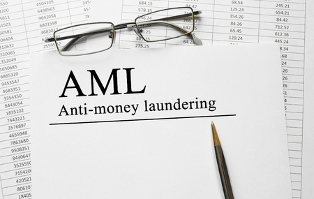 Paper with Anti-money laundering AML on a tableの写真素材