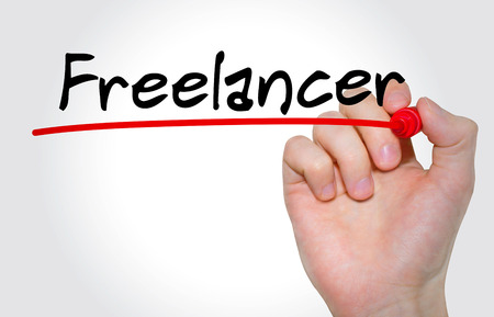 Hand writing inscription Freelancer with marker, conceptの写真素材