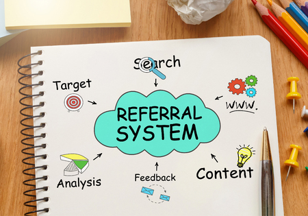 Notebook with Toolls and Notes about Referral Systemの写真素材
