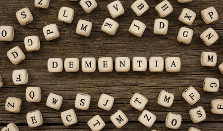 Word DEMENTIA written on wood blockの写真素材