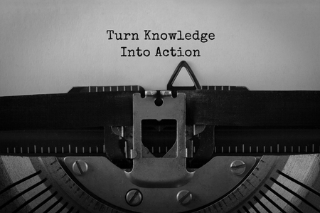 Text Turn Knowledge Into Action typed on retro typewriterの写真素材